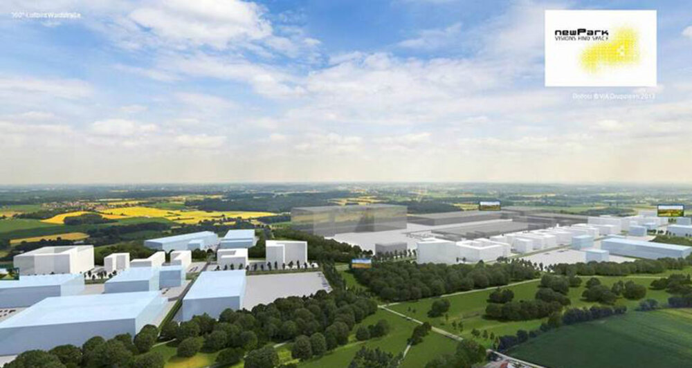 Computer-generated visualisation of a planned industrial and commercial estate set amidst a real landscape of fields.